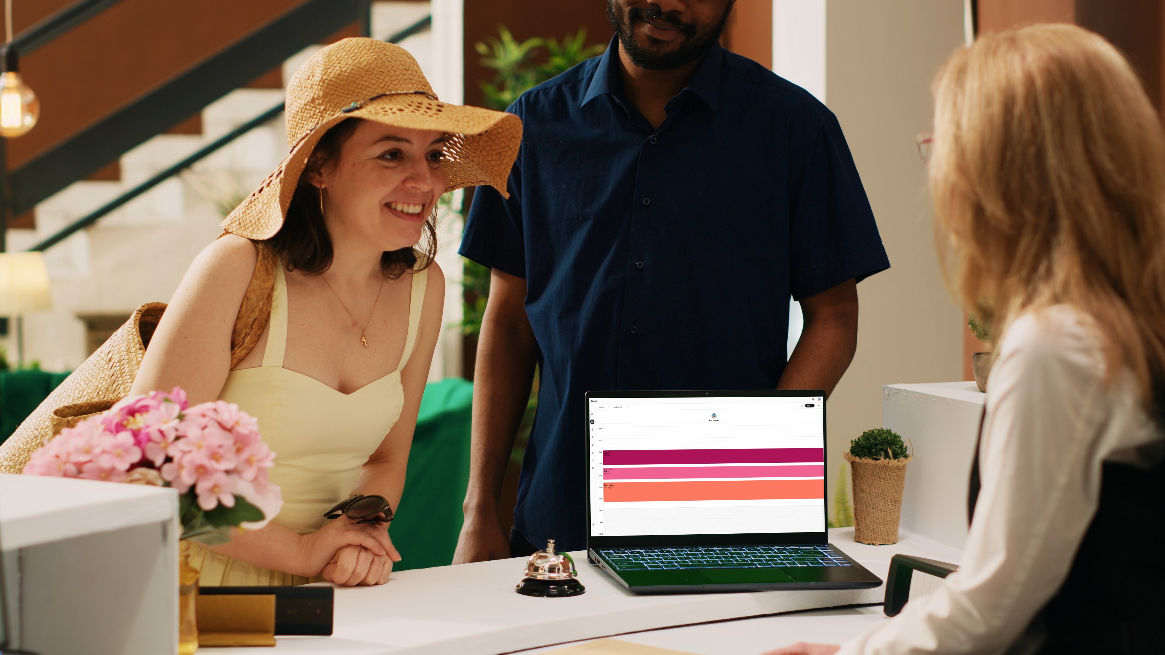 Receptionist showing salon calendar
